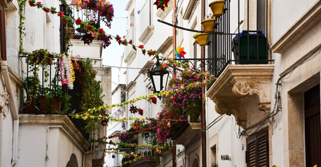 pexels photo 30433278 30433278 A vibrant Italian street adorned with flowers and decorations, capturing local charm.